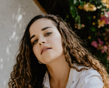 Curly-haired woman outdoors