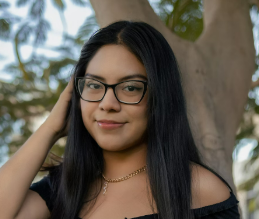 Woman in glasses by tree